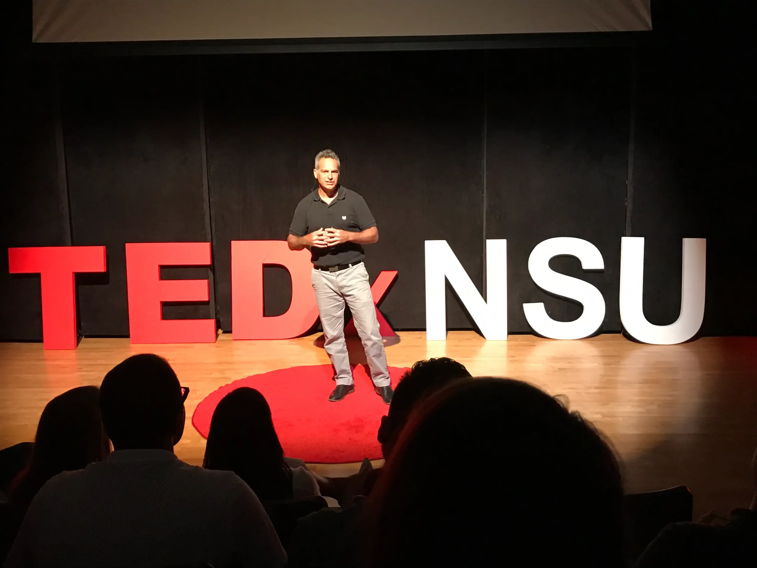 Dr. Bryan Deptula speaking on the TEDx stage